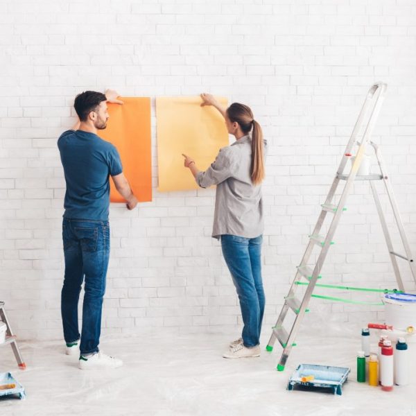 young-happy-couple-choosing-in-what-color-painting-their-new-house.jpg